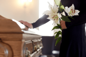Woman with flowers at a funeral